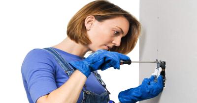 women changing a switch